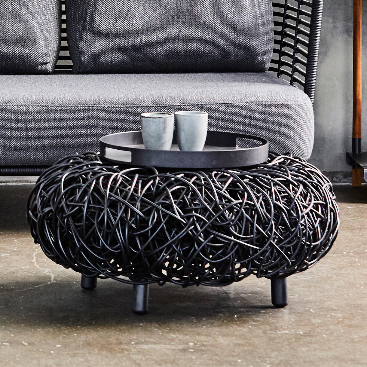 Loop Footstool by Cane-Line